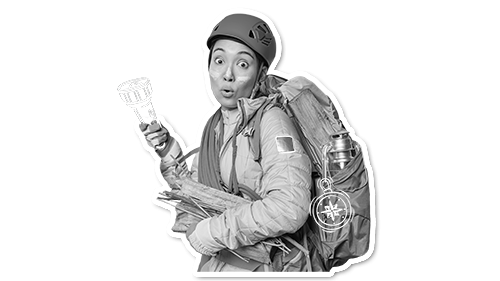 black and white image of an explorer with a torch and hard hat